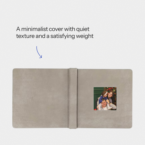 Closed cameo cover heirloom album, front view, dark fabric with photo inset