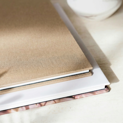 Side profile of combo cover layflat photo book showing thick pages