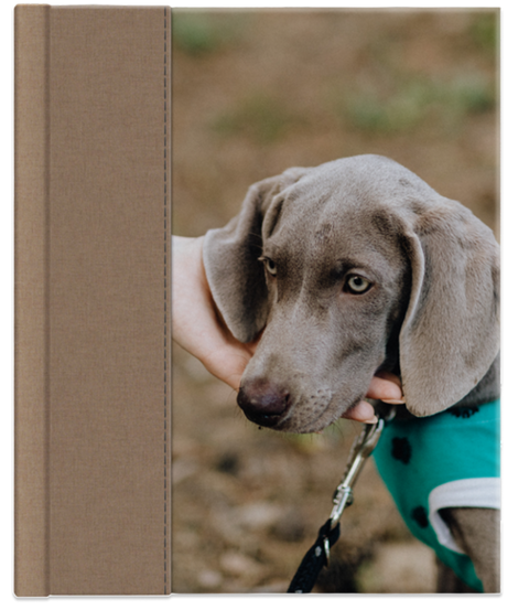 Brown notebook with a photo of a dog on the cover